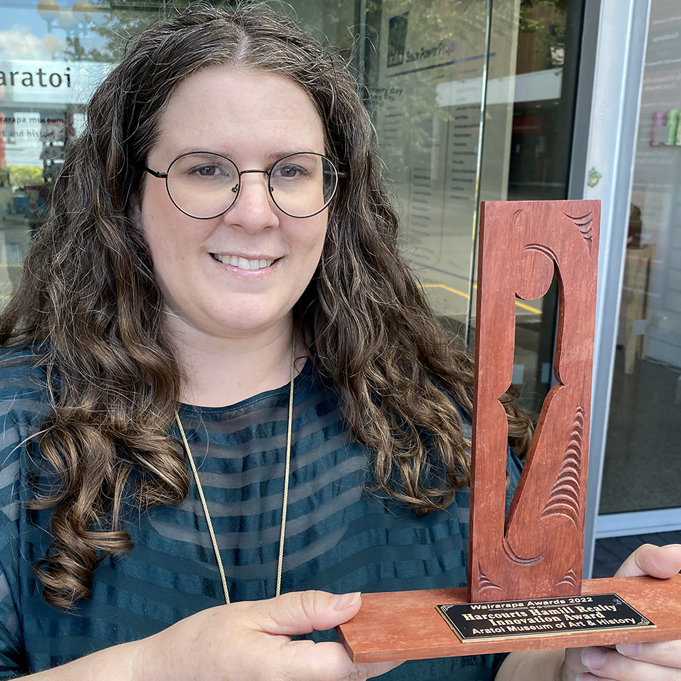 Sarah holding the award