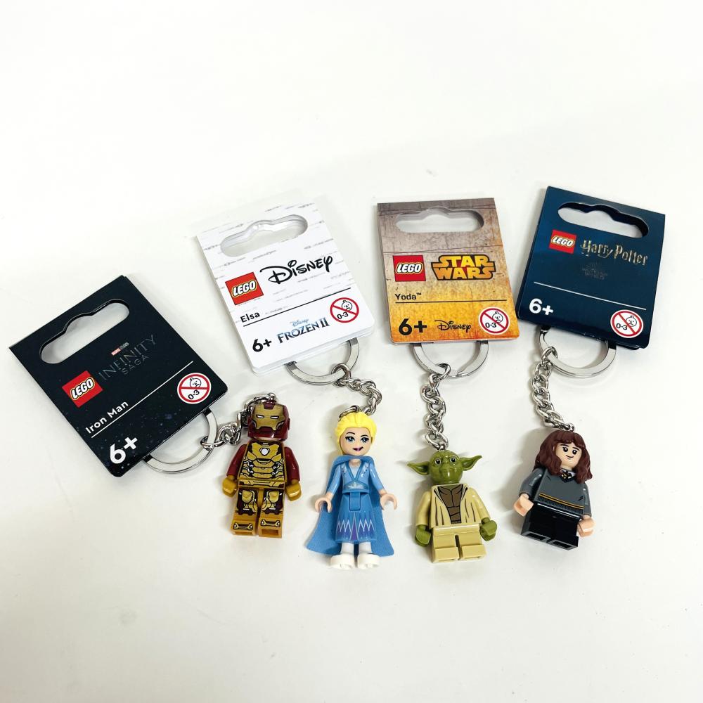 four LEGO keyrings