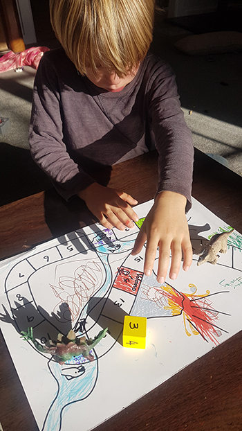 Max at work making his board game